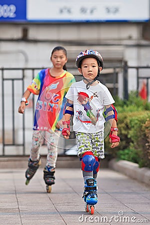 Kids practicing inline skating, Beijing, China Editorial Stock Photo